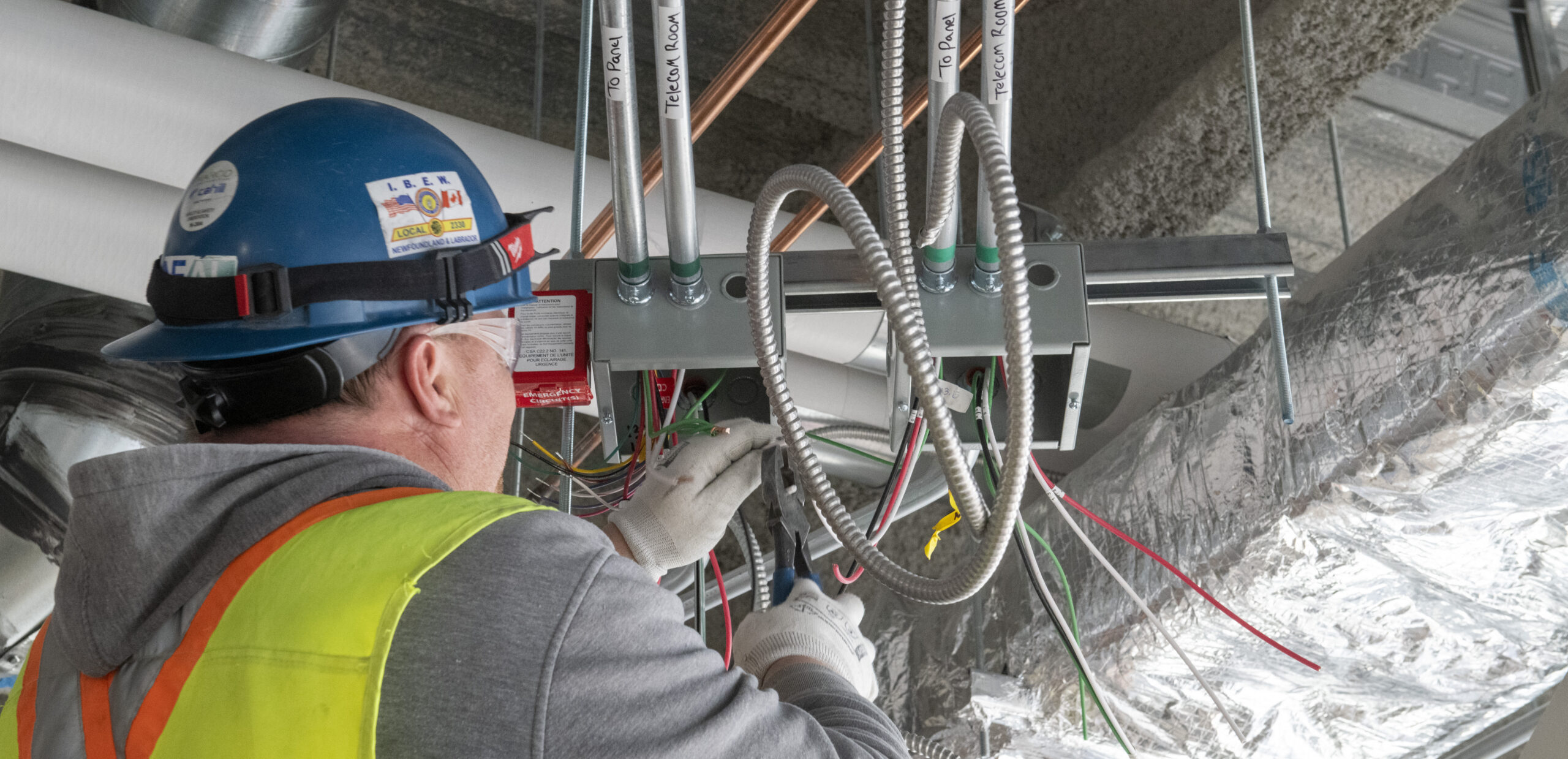 Electrician working on a cable tray