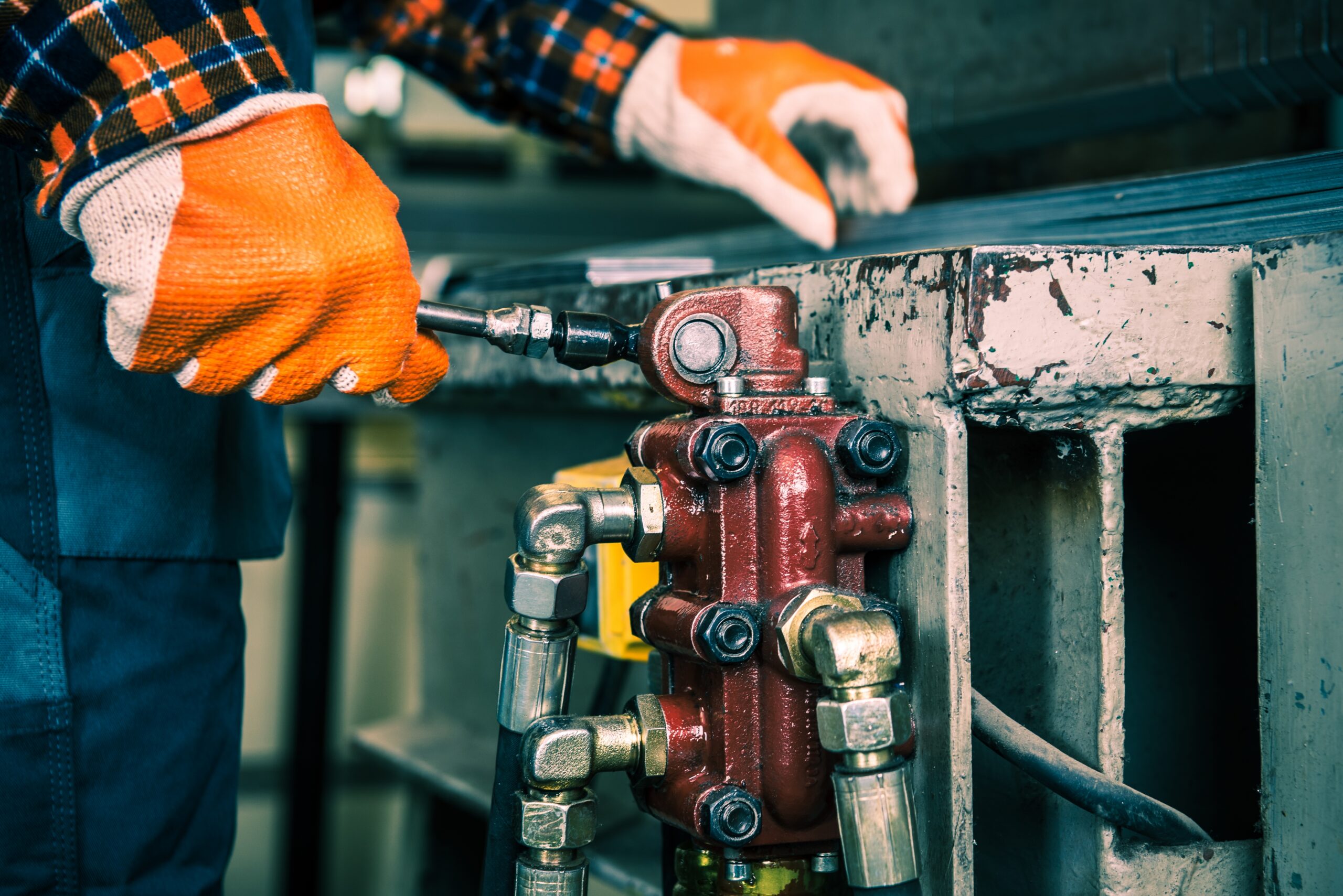 Technician servicing a hydraulic component