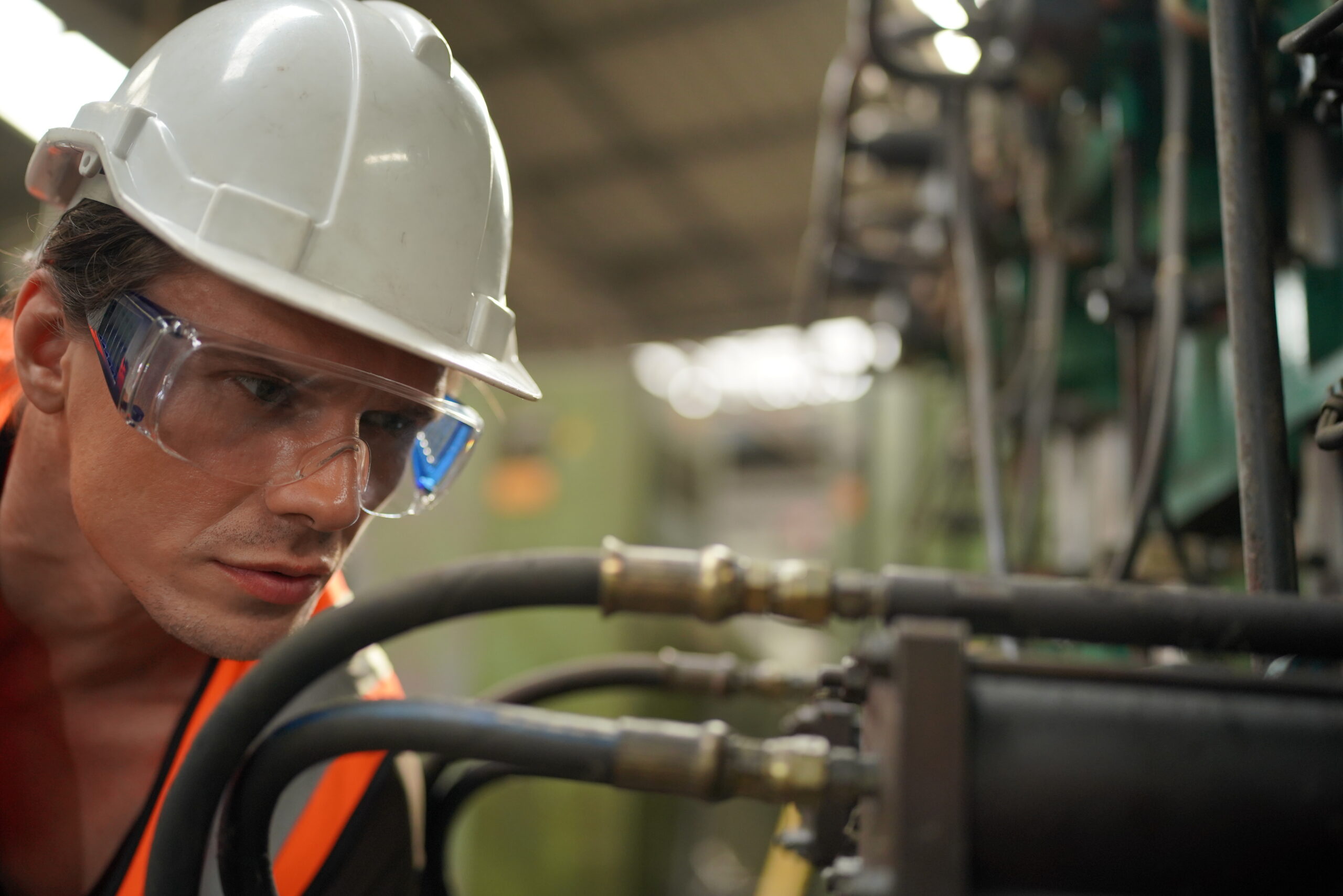 Technician inspecting a hydraulic system