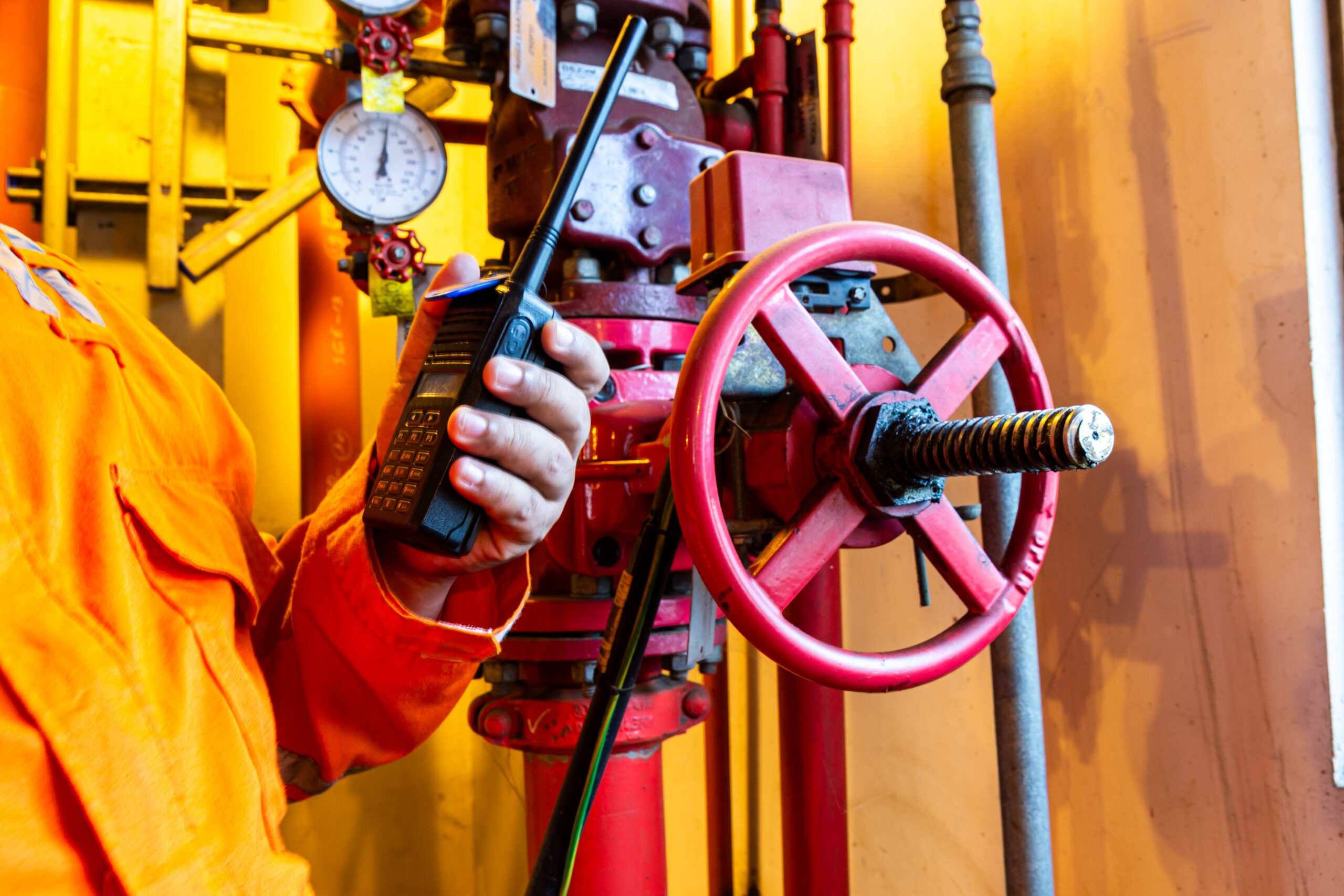 Technician testing a valve with an instrument