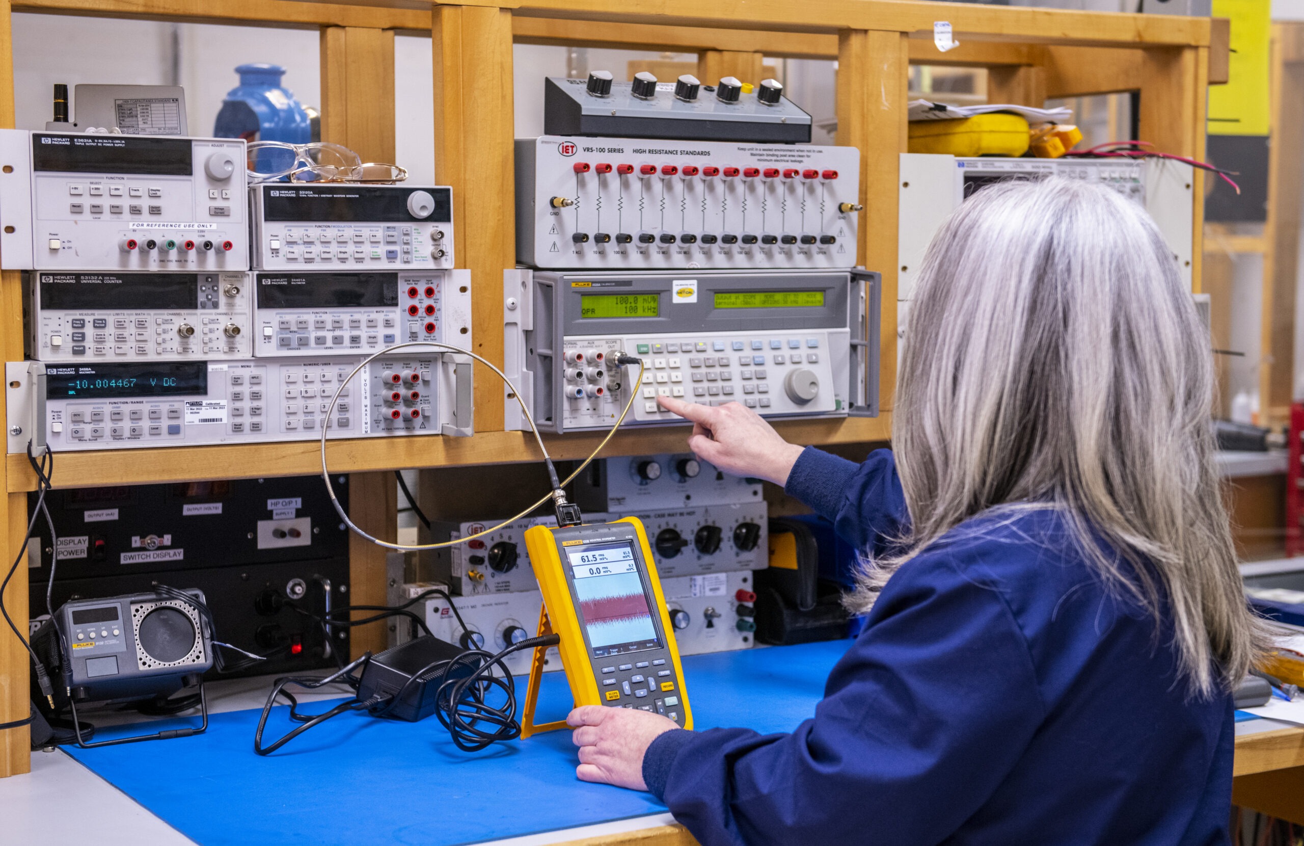 Instrumentation technician at a calibration bench