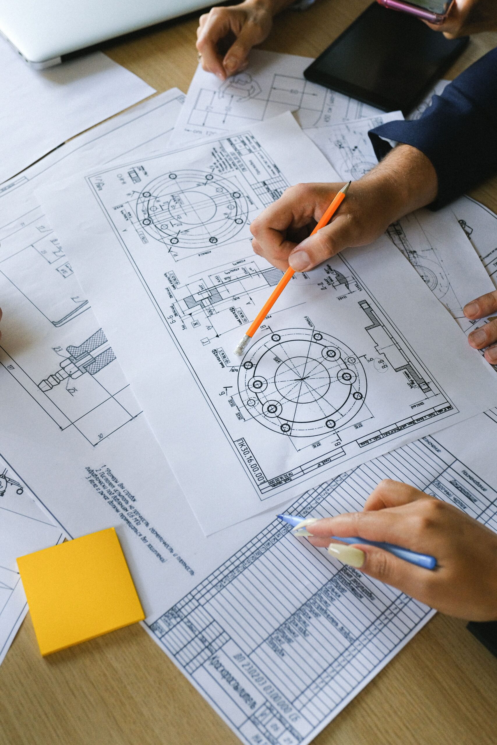 Engineering drawings being reviewed