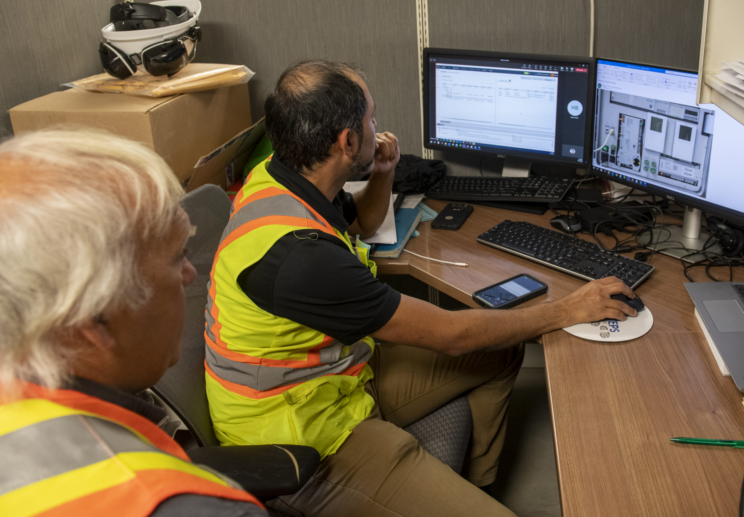 Technical staff working at a computer workstation