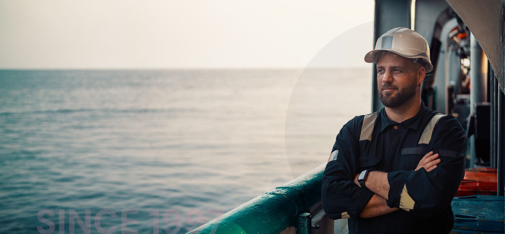 Offshore worker in safety gear on a vessel at sea off Newfoundland