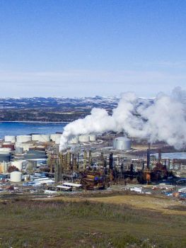 Industrial facility with steam stacks in winter