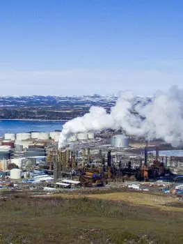 Industrial facility with steam stacks in winter
